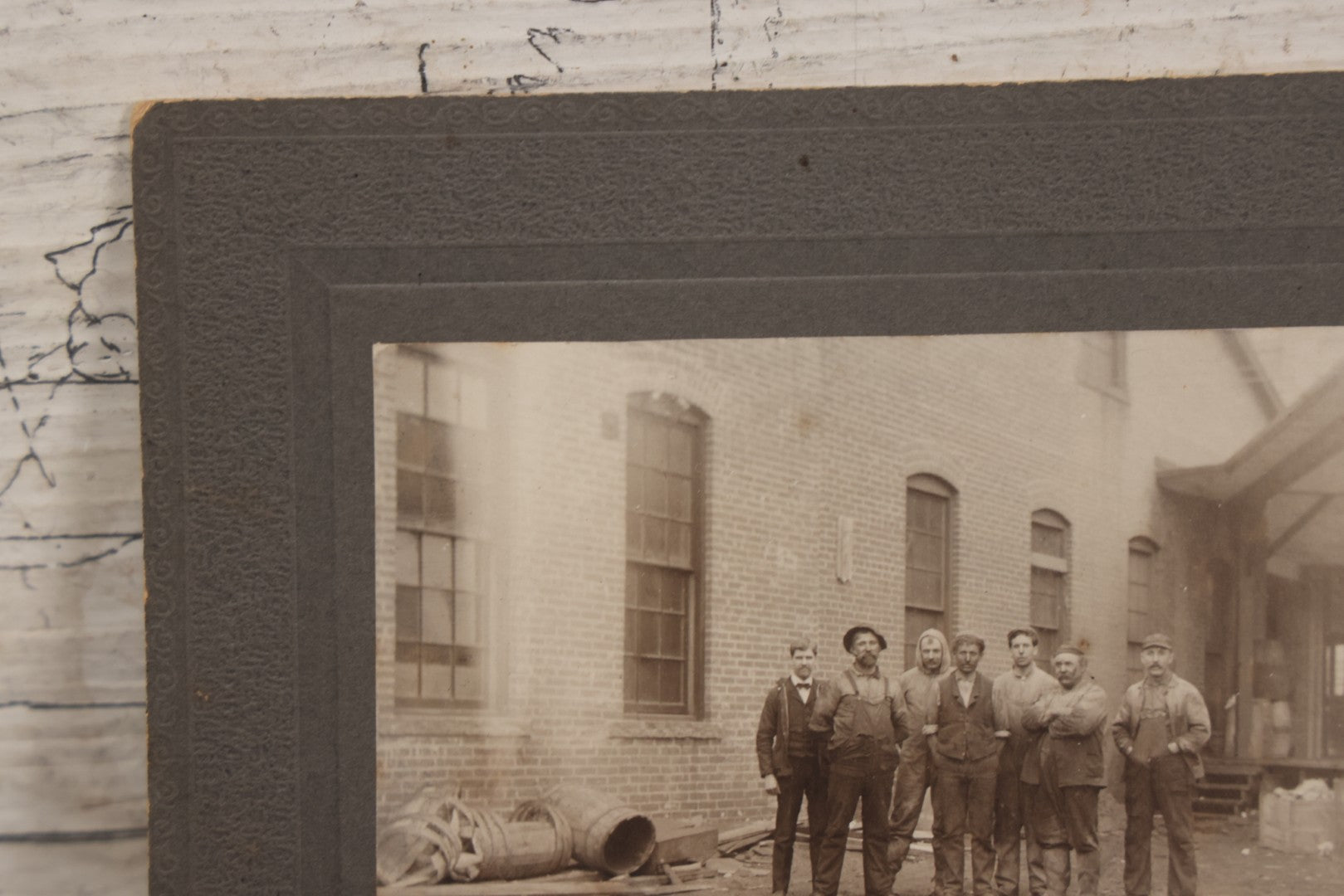 Lot 071 - Antique Boarded Occupational Photograph Of Group Of Seven Dirty Workers Posing In Work Clothes Outside Brick Workplace