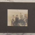 Lot 072 - Antique Boarded Occupational Photograph Of Three Men Smoking Pipes And Posing With Turn Of The Century Automobile, With Baltimore & Ohio Railroad Carriage Visible In Background, Handwritten Note On Verso, Dated October 9, 1901