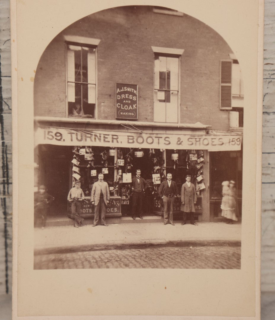 Lot 073 - Antique Cabinet Card Photograph Of The Workers And Proprietors Posing Outside Of The Storefront Of Turner Boots & Shoes And A.J. Smith Dress And Cloakmaking, New York