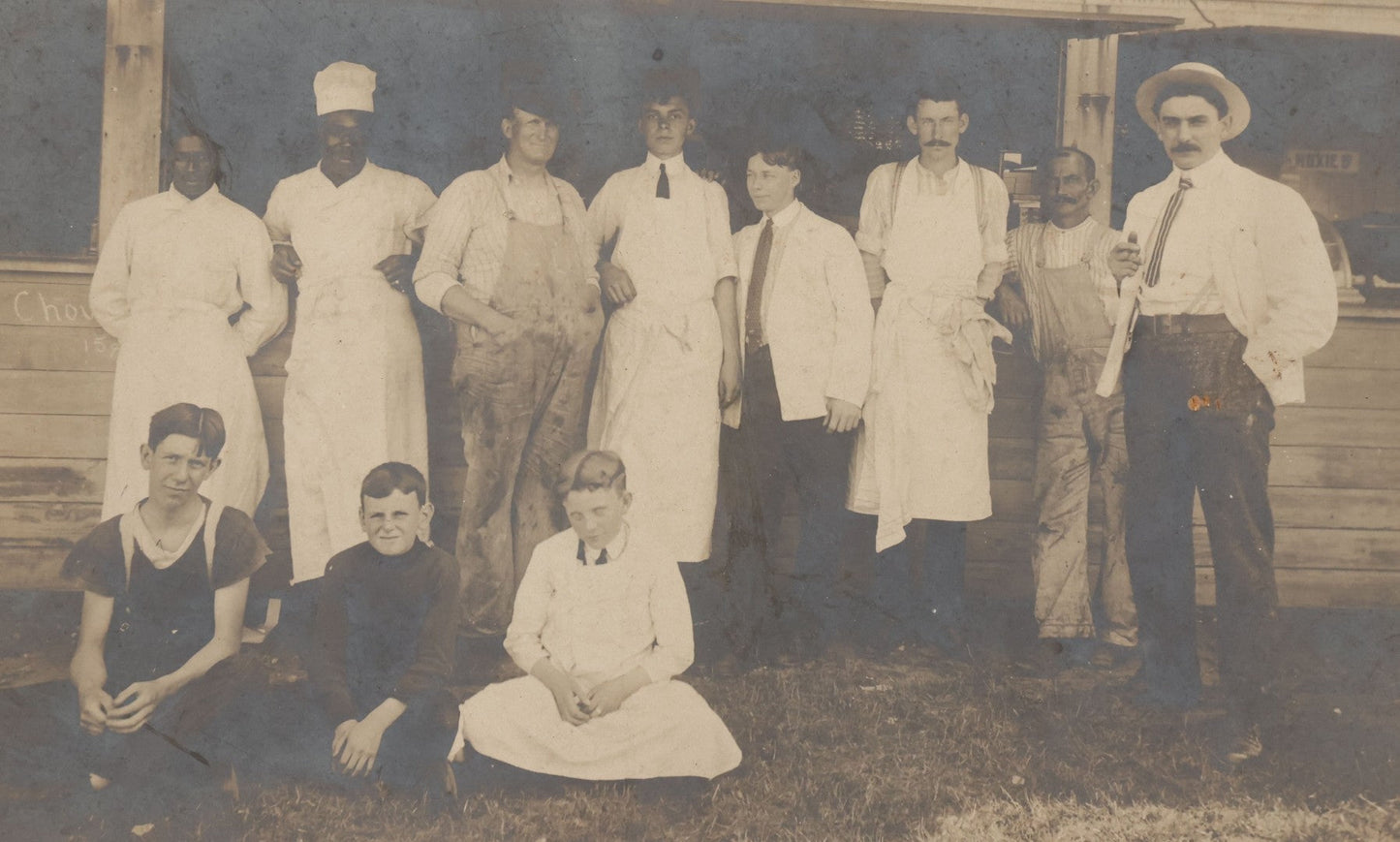 Lot 075 - Antique Boarded Occupational Photograph Of Cooks And Workers Outside Chow Hall, With Chow Hall In Background Featuring Several Moxie Soda Advertisements