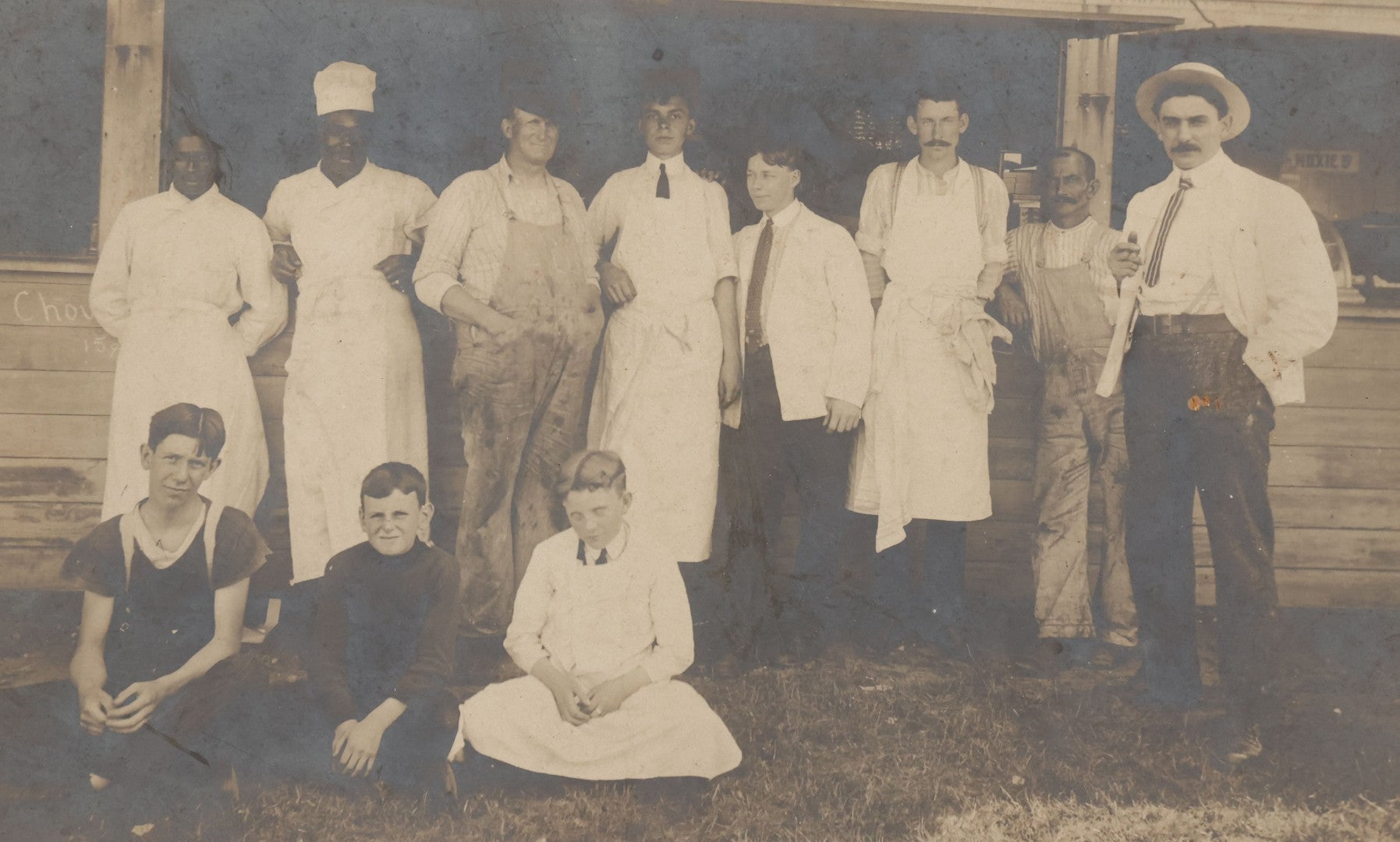 Lot 075 - Antique Boarded Occupational Photograph Of Cooks And Workers Outside Chow Hall, With Chow Hall In Background Featuring Several Moxie Soda Advertisements