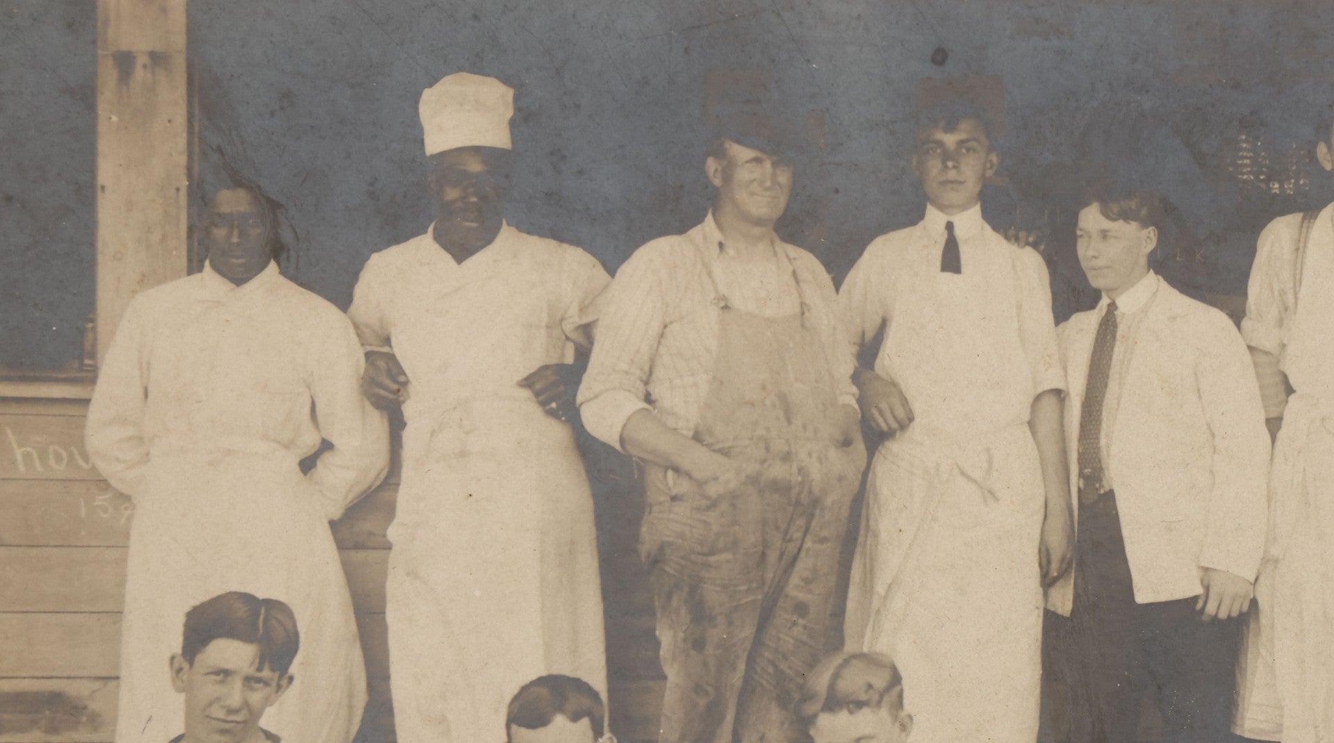 Lot 075 - Antique Boarded Occupational Photograph Of Cooks And Workers Outside Chow Hall, With Chow Hall In Background Featuring Several Moxie Soda Advertisements