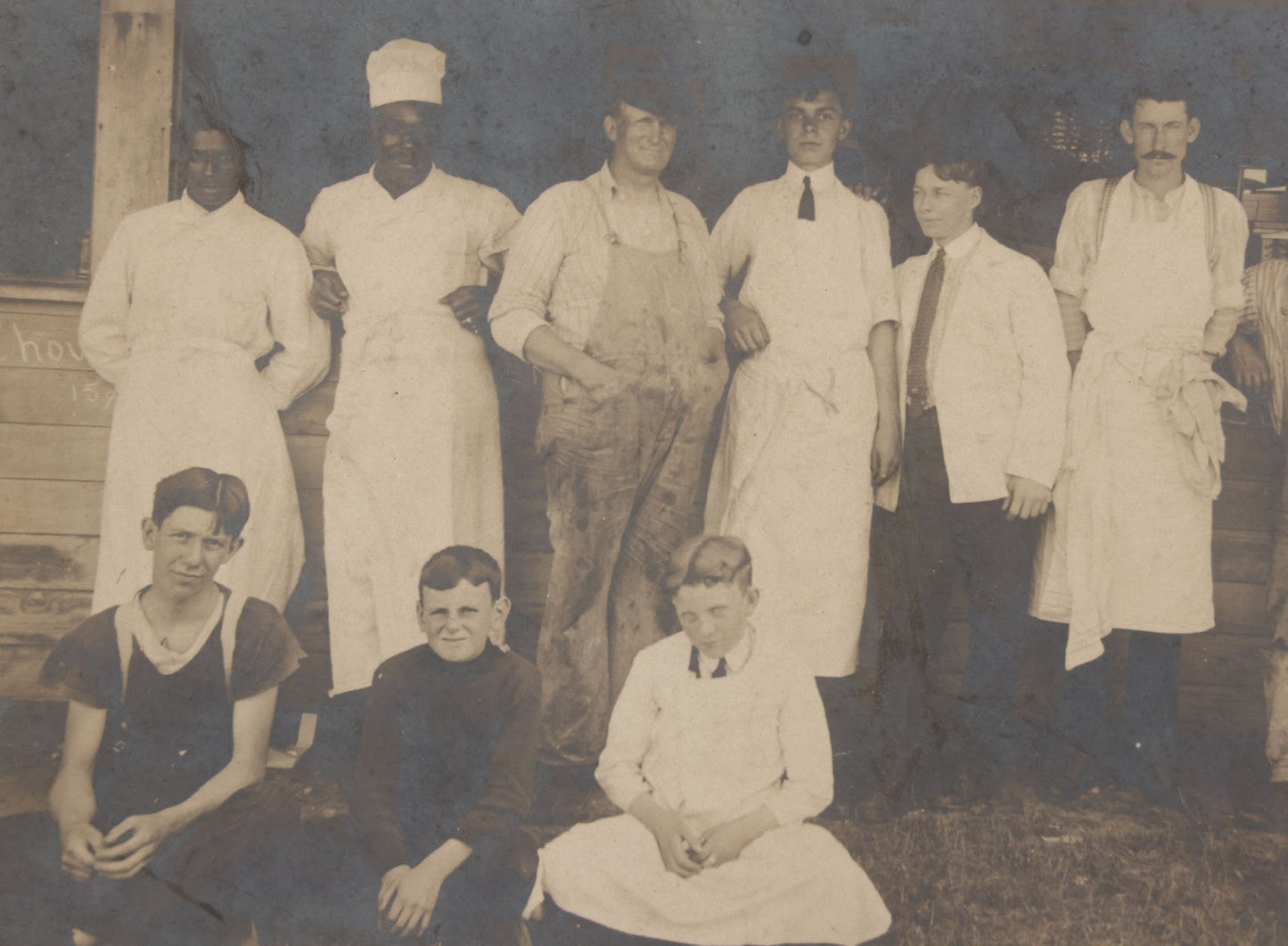 Lot 075 - Antique Boarded Occupational Photograph Of Cooks And Workers Outside Chow Hall, With Chow Hall In Background Featuring Several Moxie Soda Advertisements