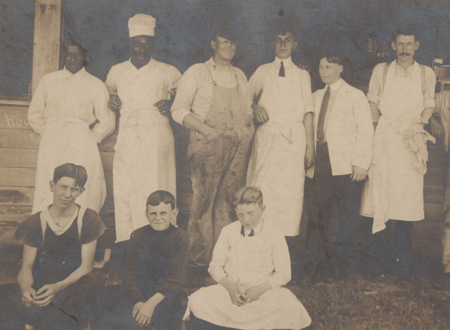 Lot 075 - Antique Boarded Occupational Photograph Of Cooks And Workers Outside Chow Hall, With Chow Hall In Background Featuring Several Moxie Soda Advertisements