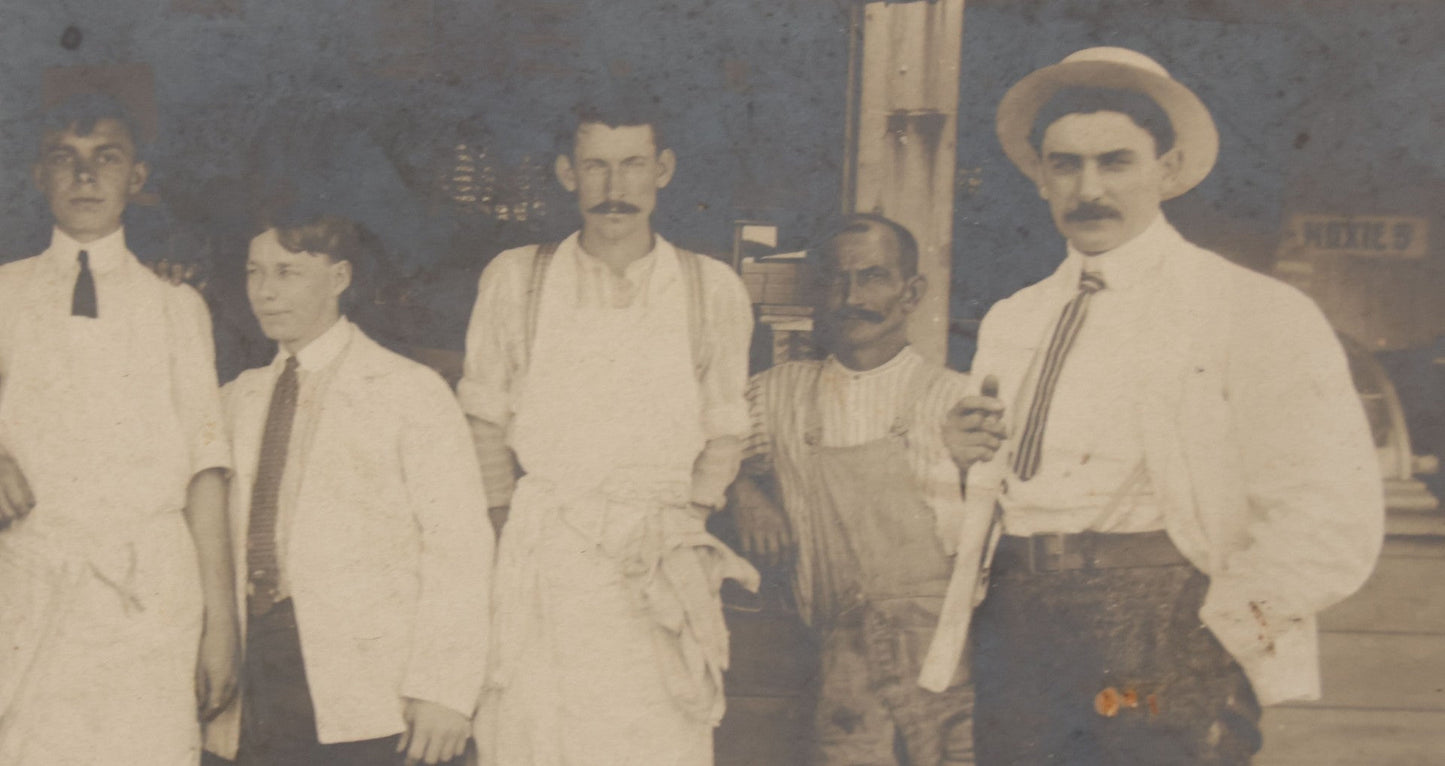 Lot 075 - Antique Boarded Occupational Photograph Of Cooks And Workers Outside Chow Hall, With Chow Hall In Background Featuring Several Moxie Soda Advertisements