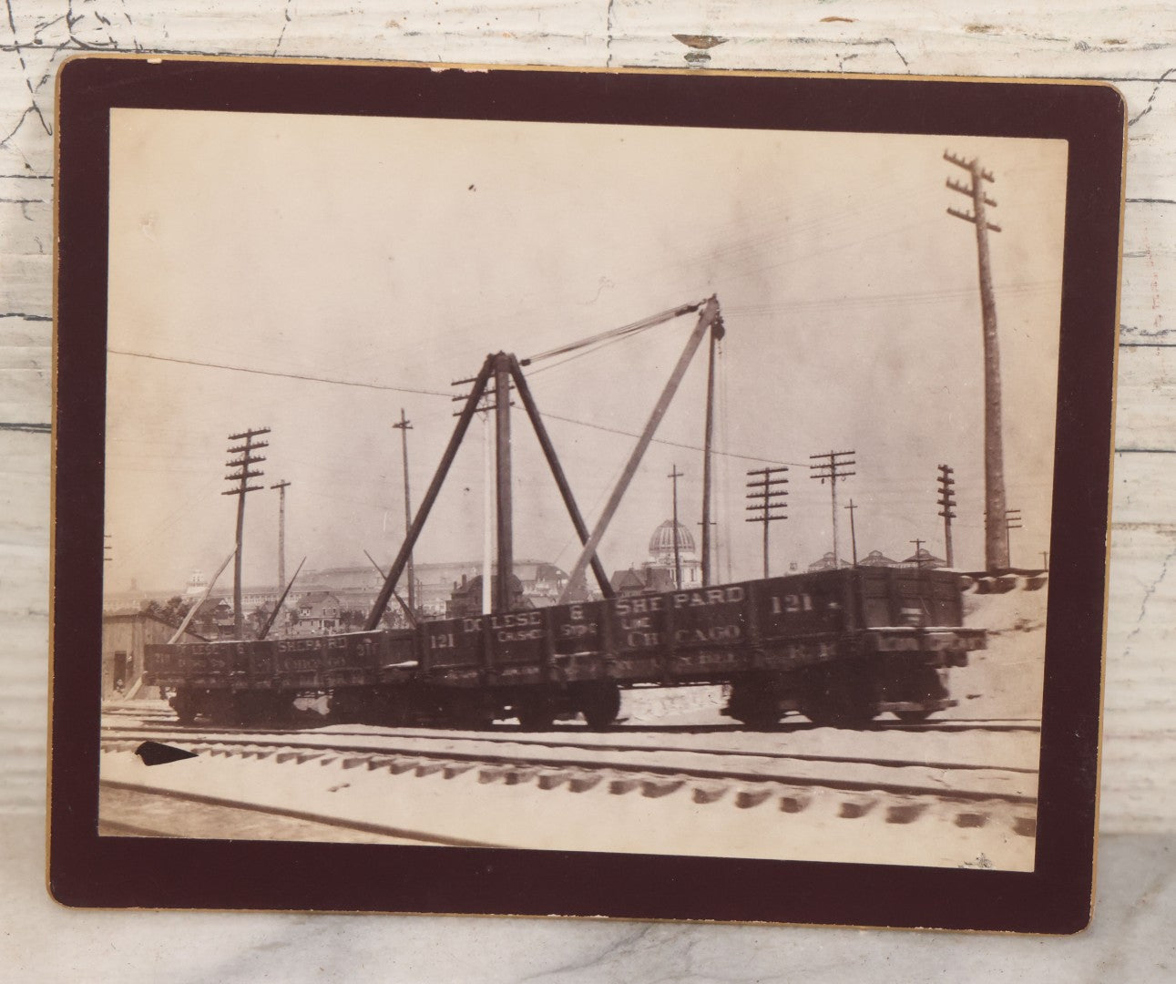 Lot 078 - Antique Boarded Photograph Of Two Train Cars On Tracks With Advertising For Dolese & Shepard, Chicago And Other Lettering, In Front Of Chicago Worlds Fair Buildings, Dame, Stoddard & Kendall, Developers, Boston