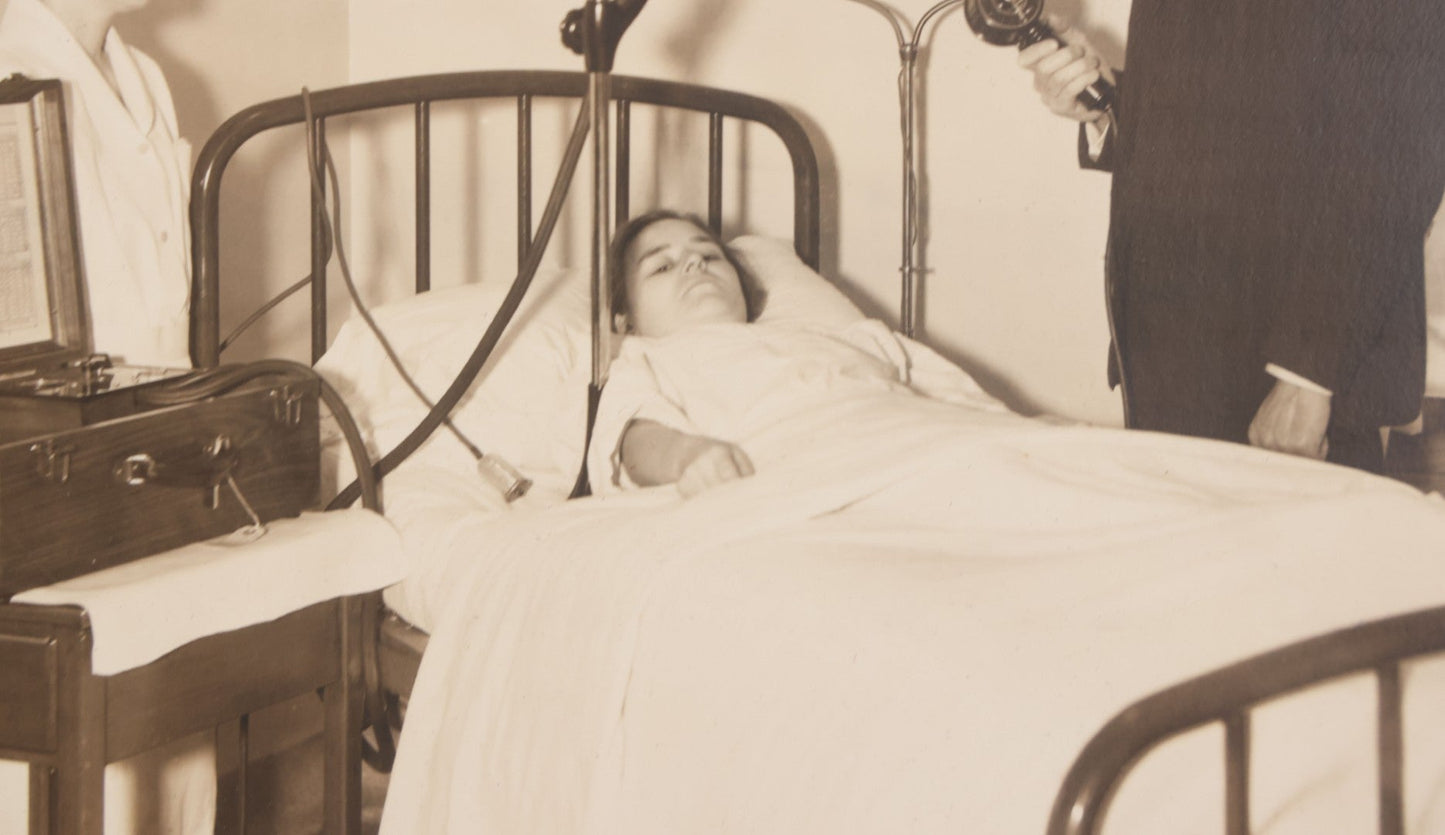 Lot 080 - Vintage Photograph In Paper Frame Of Woman In Hospital Bed With Her Nurse And Doctor About To Utilize An Unknown Medical Apperatus, C.L. Smith & Co., Photographers, Norwood, Massachusetts