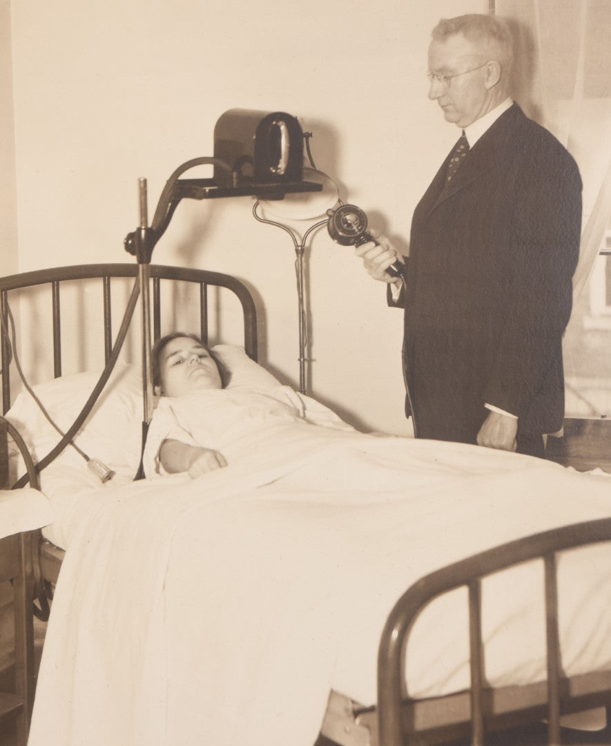 Lot 080 - Vintage Photograph In Paper Frame Of Woman In Hospital Bed With Her Nurse And Doctor About To Utilize An Unknown Medical Apperatus, C.L. Smith & Co., Photographers, Norwood, Massachusetts