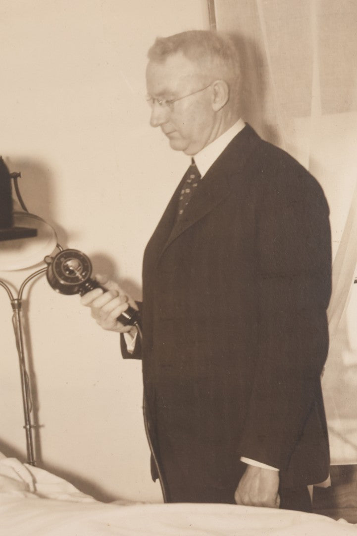 Lot 080 - Vintage Photograph In Paper Frame Of Woman In Hospital Bed With Her Nurse And Doctor About To Utilize An Unknown Medical Apperatus, C.L. Smith & Co., Photographers, Norwood, Massachusetts