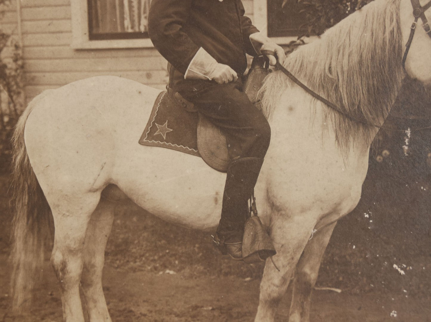 Lot 083 - Antique Boarded Photograph Of Man In Uniform Sitting Horseback On White Horse With Saddle Blanket Emblazoned With Star, Western Hat And Badge