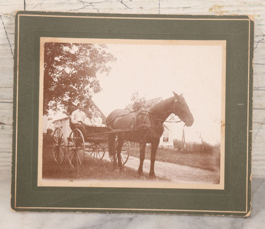 Lot 088 - Antique Boarded Photograph Of Family On Horsedrawn Cart Identified As Herbert & Vivian Eastman And Children Robert Goss & Charles Eastman, Outbuildings Visible In Background