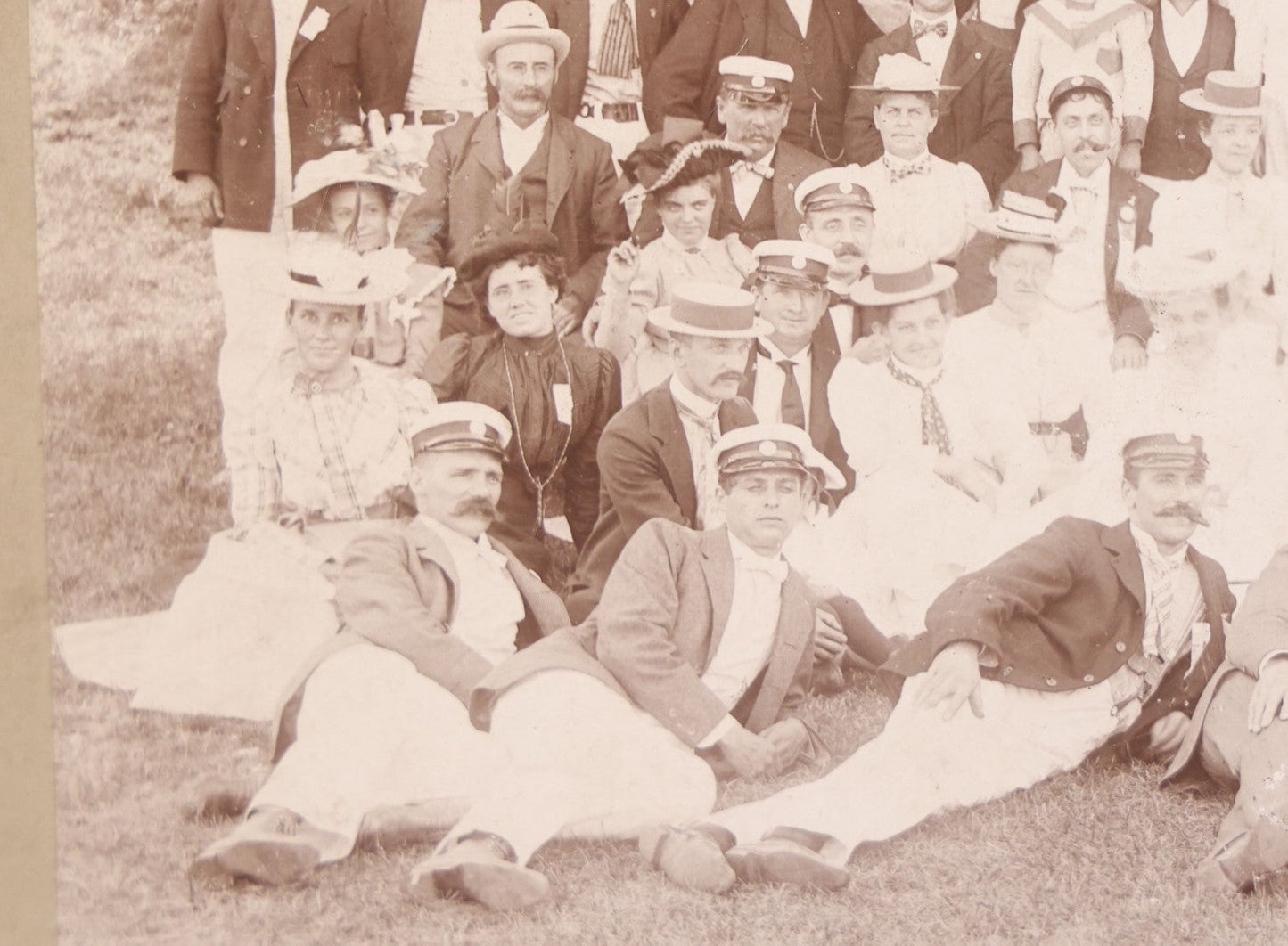 Lot 107 - Antique Double Sided Boarded Photograph Of Outing Of Fancy Dressed Men In White Pants, White Caps, With Ribbons And Their Wives