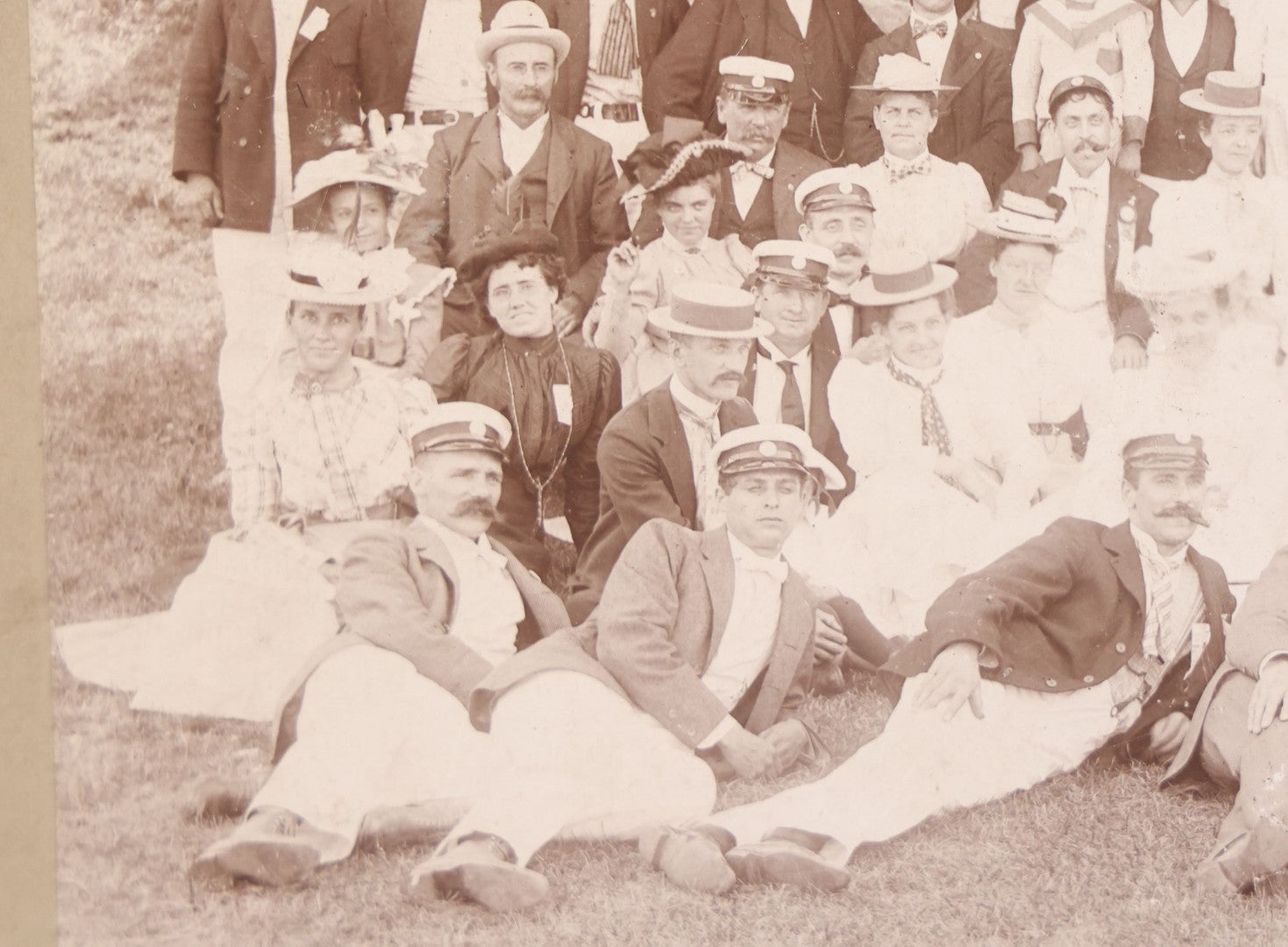 Lot 107 - Antique Double Sided Boarded Photograph Of Outing Of Fancy Dressed Men In White Pants, White Caps, With Ribbons And Their Wives