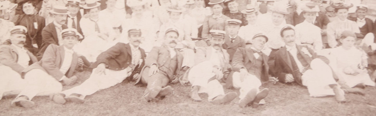 Lot 107 - Antique Double Sided Boarded Photograph Of Outing Of Fancy Dressed Men In White Pants, White Caps, With Ribbons And Their Wives