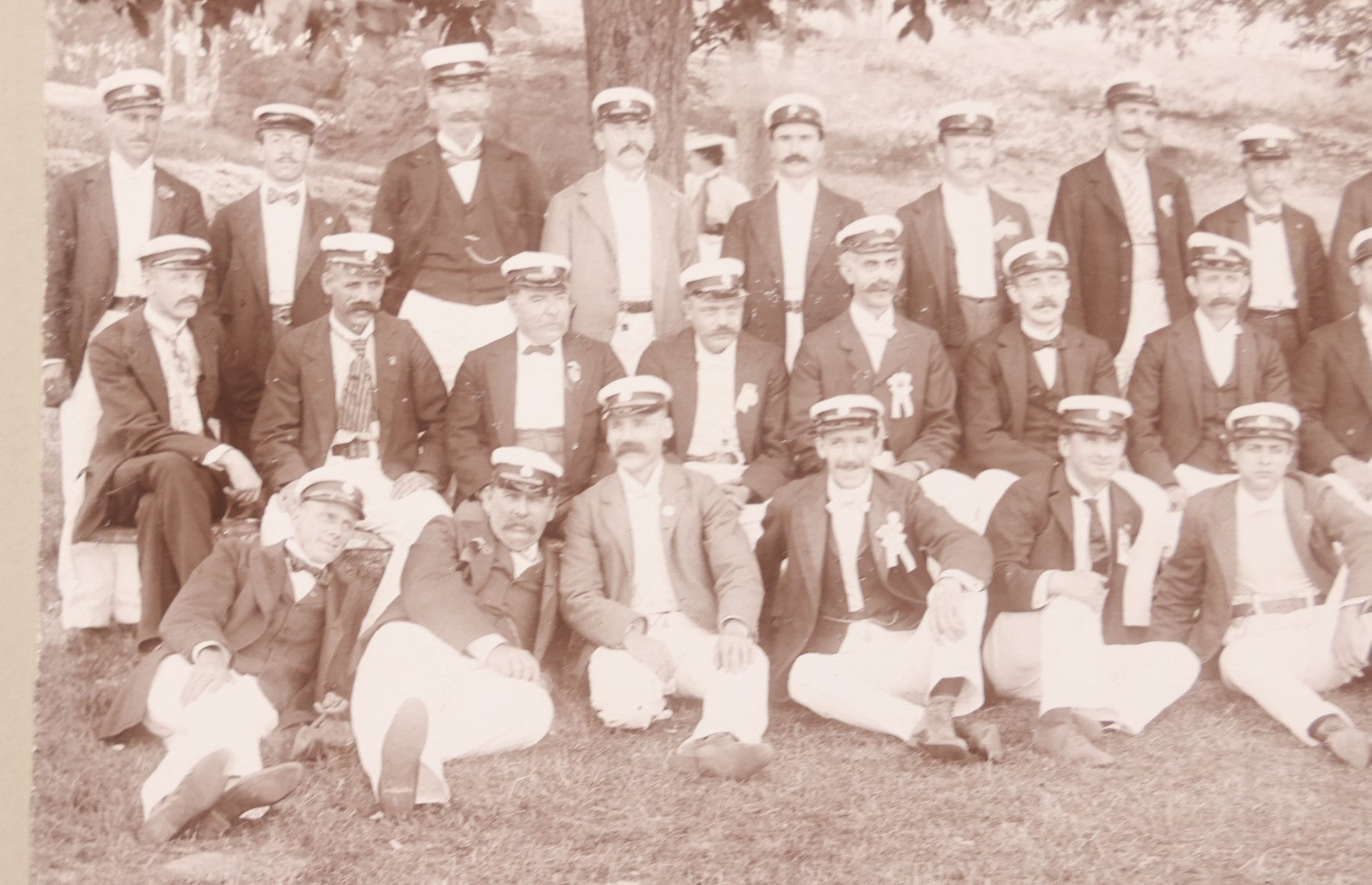 Lot 107 - Antique Double Sided Boarded Photograph Of Outing Of Fancy Dressed Men In White Pants, White Caps, With Ribbons And Their Wives