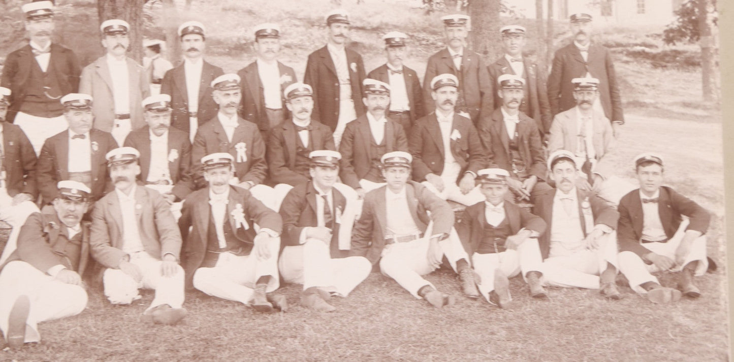 Lot 107 - Antique Double Sided Boarded Photograph Of Outing Of Fancy Dressed Men In White Pants, White Caps, With Ribbons And Their Wives