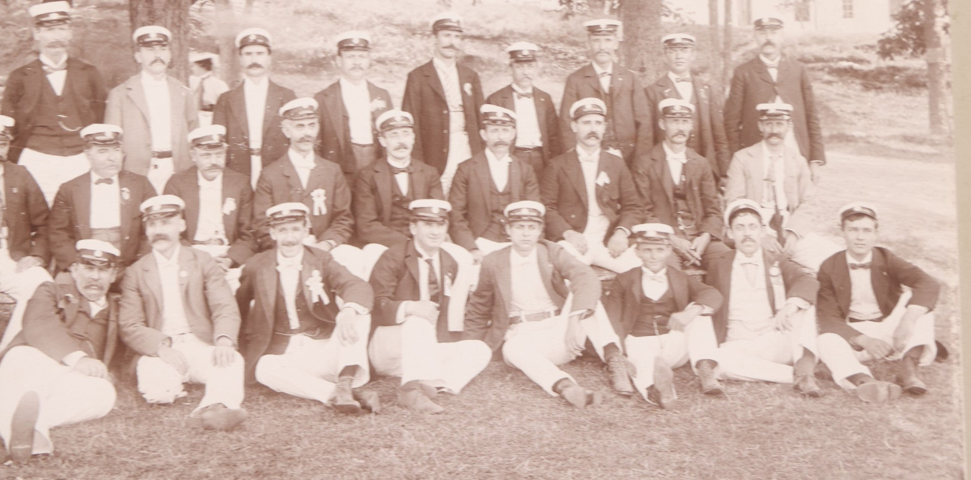 Lot 107 - Antique Double Sided Boarded Photograph Of Outing Of Fancy Dressed Men In White Pants, White Caps, With Ribbons And Their Wives