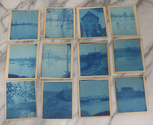 Lot 122 - Grouping Of Twelve Antique Paper Mounted Cyanotype Photographs Of Various Scenes Including Oil Well, Flooding, Canoeing, And Women Posing Outside Of Home