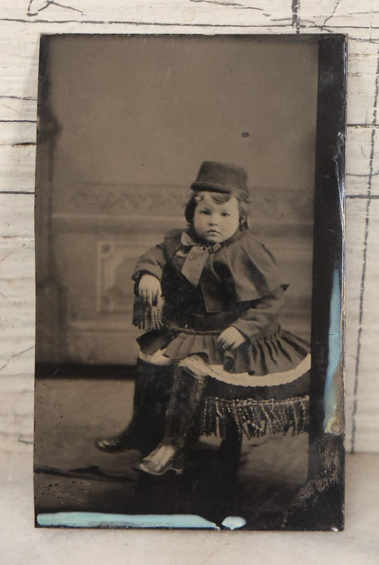 Lot 130 - Single Antique Tintype Photograph Of Young Boy In Dress With Cap And Chubby Face