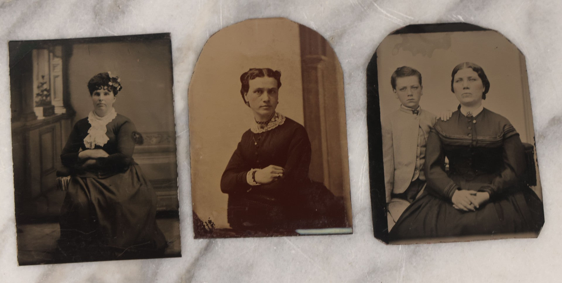 Lot 132 - Grouping Of Ten Antique Tintype Photographs Including Half Plate Of Boy Leaning Against Branch Chair, Young Man With Bowtie, Gaunt Woman With Jewelry, Middle Aged Couple, Mother And Son, And More