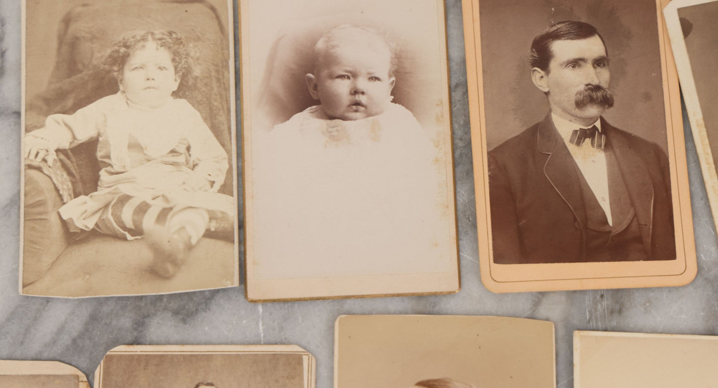 Lot 134 - Grouping Of 19 Antique Carte De Visite C.D.V. Photographs Including Pretty Woman With Long Blond Hair, Man With Mutton Chops, Little Girl Seated On Table, Incredulous Baby, Woman With Ruffled Collar, Man With Preposterous Mustache, And More