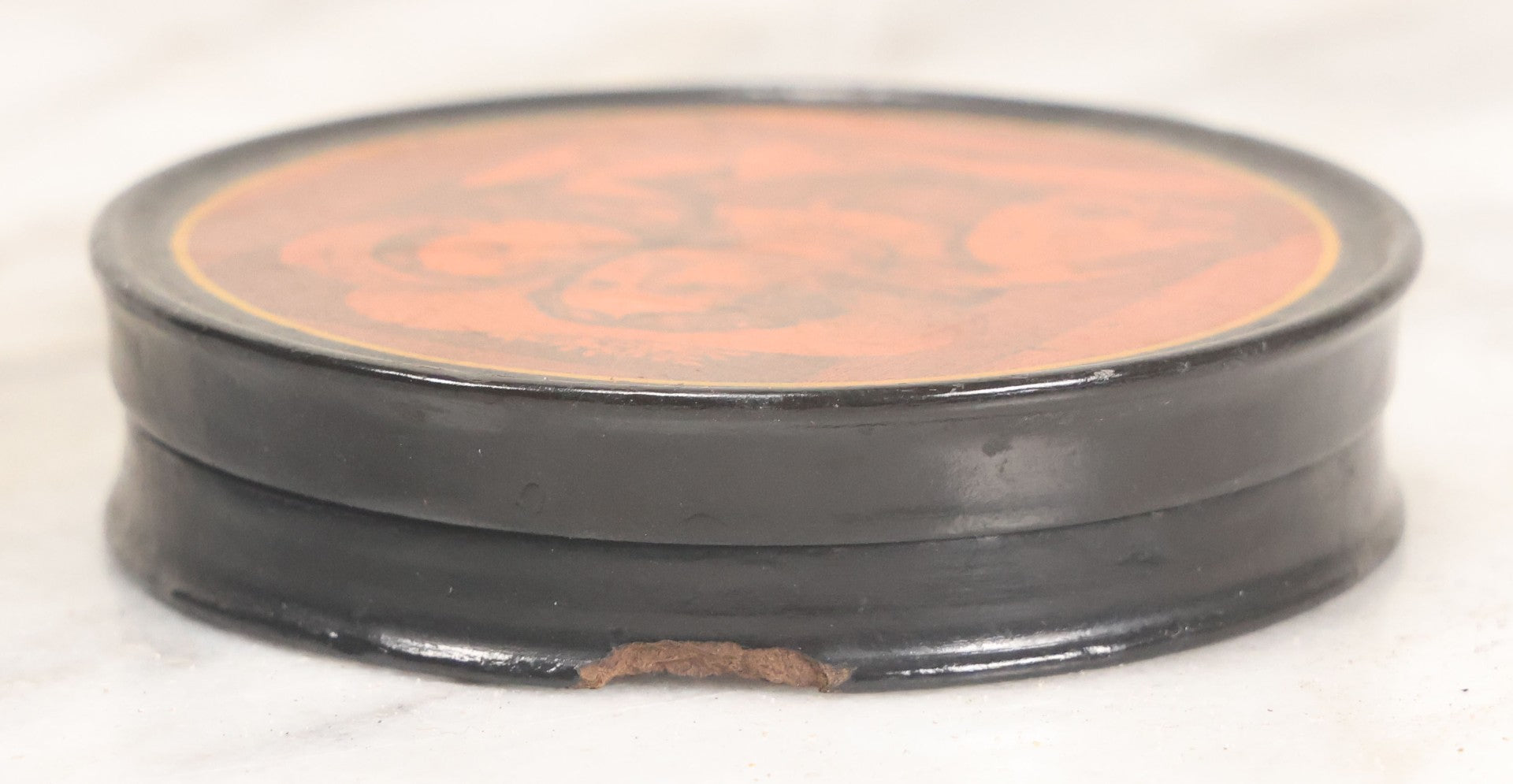 Lot 011 - Antique Laquered Papier Mache Dresser Box With Lithographed Lid Of One Woman Comforting Another, Note Small Loss To Bottom Lip