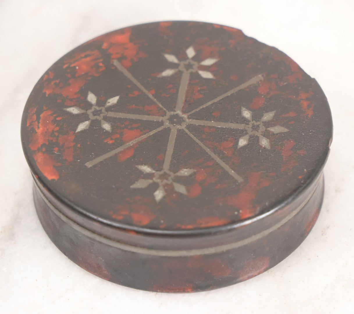 Lot 012 - Antique Laquered Papier Mache Dresser Box With Inlaid Geometric Cover And Red Paint Marbling, Note Loss To Edge Of Lid