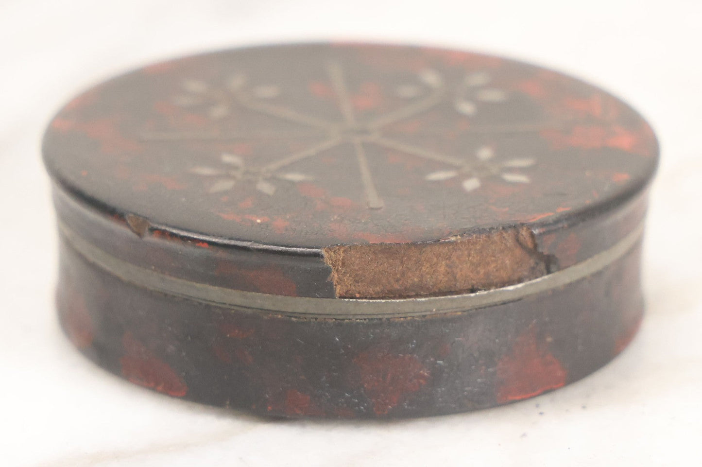Lot 012 - Antique Laquered Papier Mache Dresser Box With Inlaid Geometric Cover And Red Paint Marbling, Note Loss To Edge Of Lid