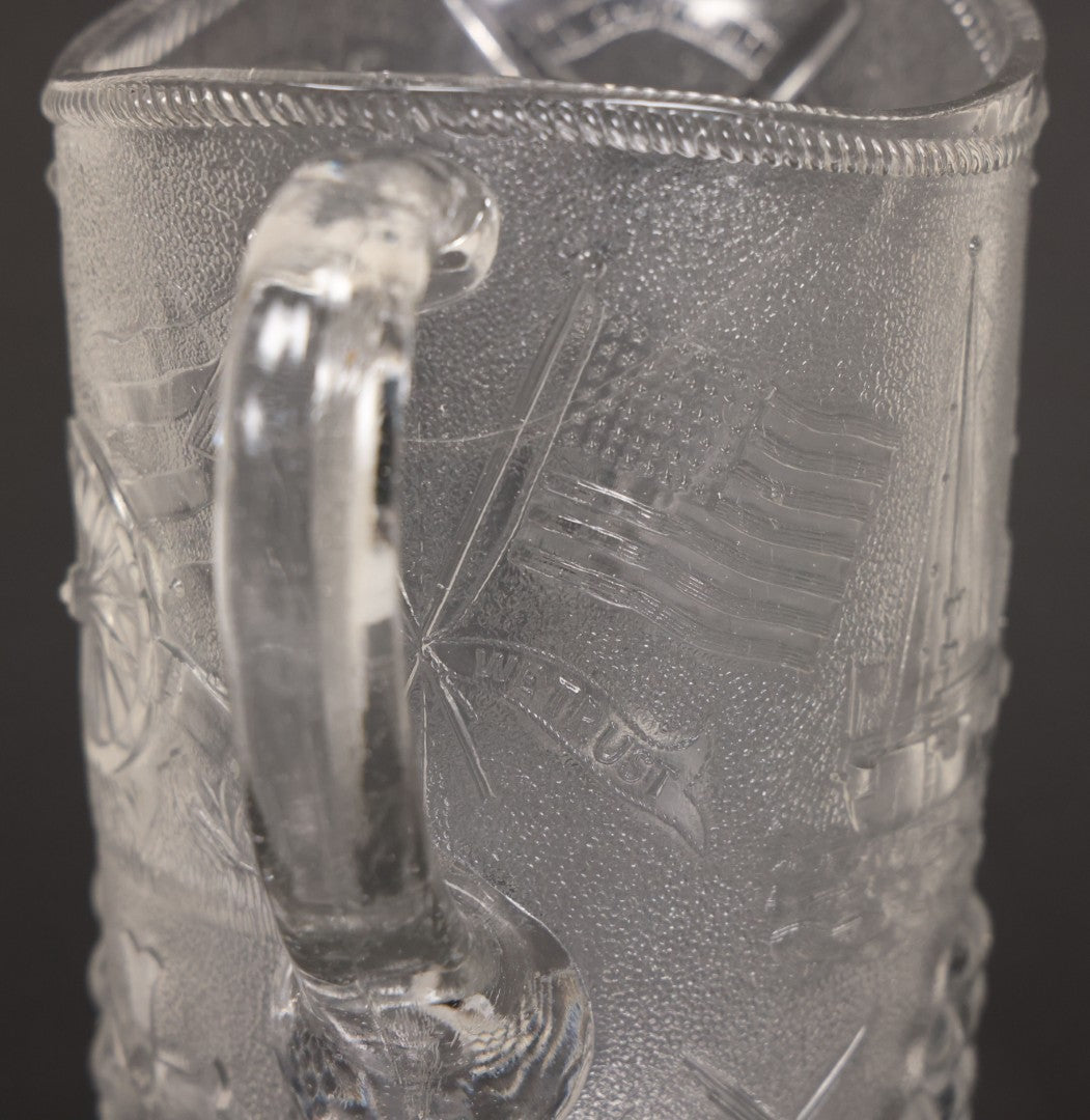 Lot 027 - Antique Early American Pattern Glass E.A.P.G. Spanish American War Battle Of Manila Bay Commemorative Pitcher With Admiral Dewey And U.S.S. Olympia, Patriotic Symbols Including Weaponry And Flags, Manufactured By Beatty-Brady Glass Co., Indiana