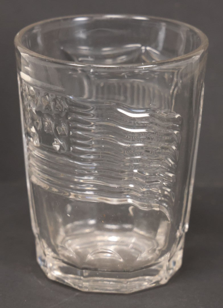 Lot 028 - Vintage American Pattern Glass Drinking Cup With American Flag, Patriotic Shield, And Rifle Motifs