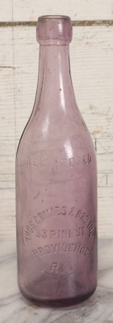 Lot 032 - Antique Purple Glass Bottle From Thos. Grimes & Bro. Inc., Providence, Rhode Island, 9" Height