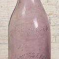 Lot 032 - Antique Purple Glass Bottle From Thos. Grimes & Bro. Inc., Providence, Rhode Island, 9" Height