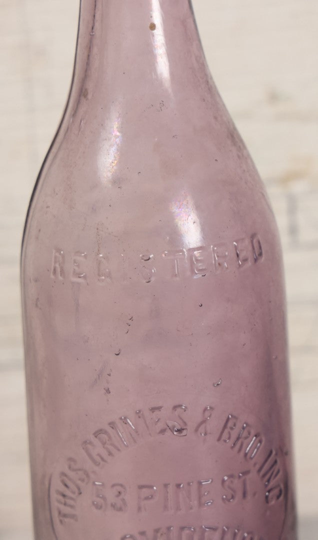 Lot 032 - Antique Purple Glass Bottle From Thos. Grimes & Bro. Inc., Providence, Rhode Island, 9" Height