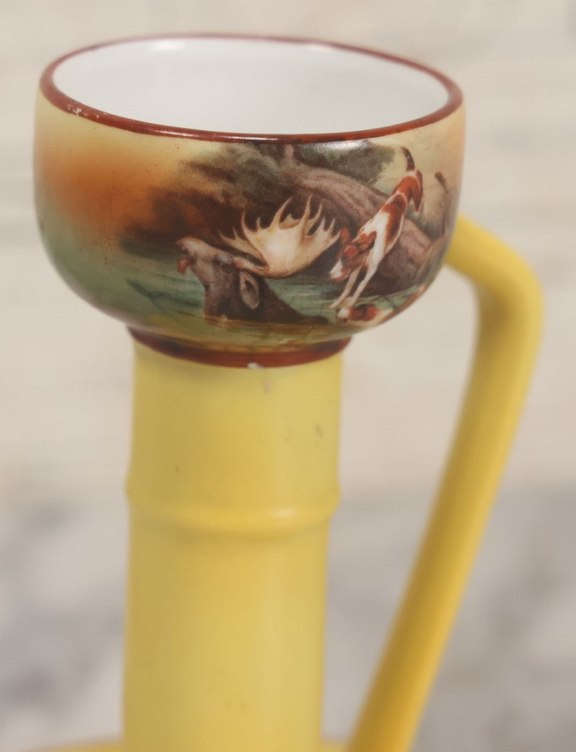 Lot 038 - Antique Yellow Painted Candlestick With Hunting Dogs Attacking Swimming Moose Motif, Manufactured By Royal Bayreuth, Bavaria, 5-3/8" Height