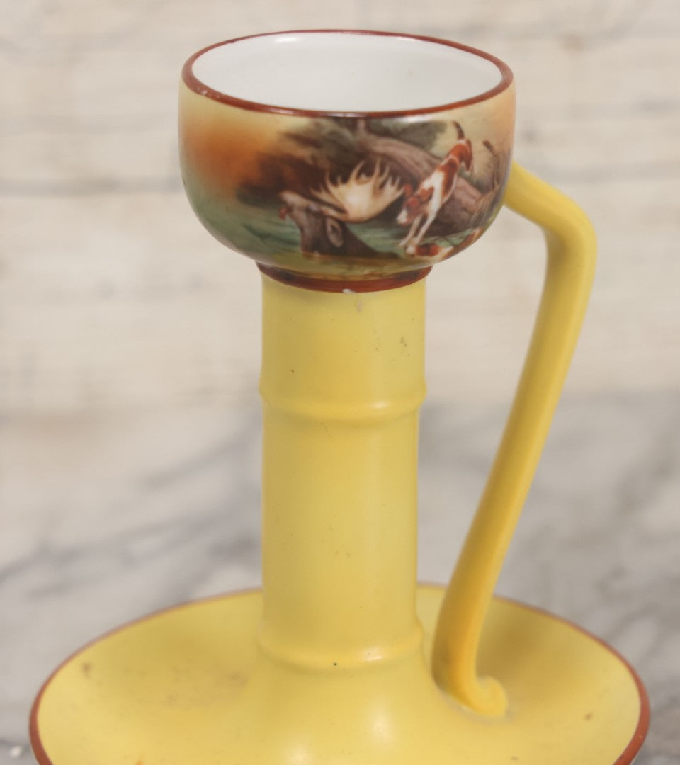Lot 038 - Antique Yellow Painted Candlestick With Hunting Dogs Attacking Swimming Moose Motif, Manufactured By Royal Bayreuth, Bavaria, 5-3/8" Height