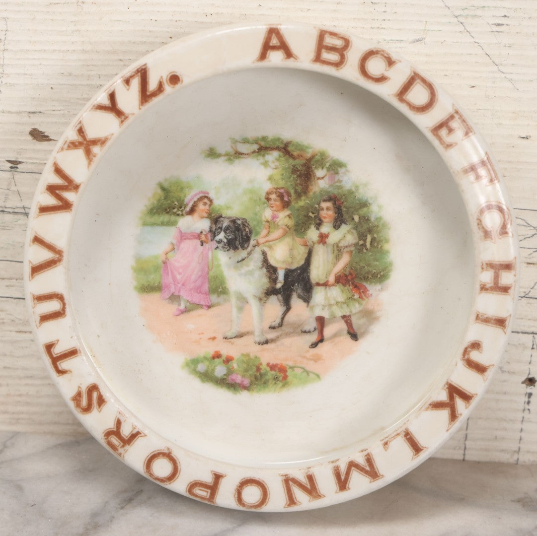 Lot 039 - Pair Of Antique Children's Plate Bowls Including Alphabet Dish With Children Riding Dog And Baby Dish With Child Playing With Toys, Marked Made In Czecho-Slovakia