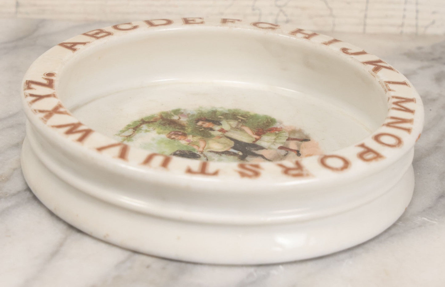 Lot 039 - Pair Of Antique Children's Plate Bowls Including Alphabet Dish With Children Riding Dog And Baby Dish With Child Playing With Toys, Marked Made In Czecho-Slovakia