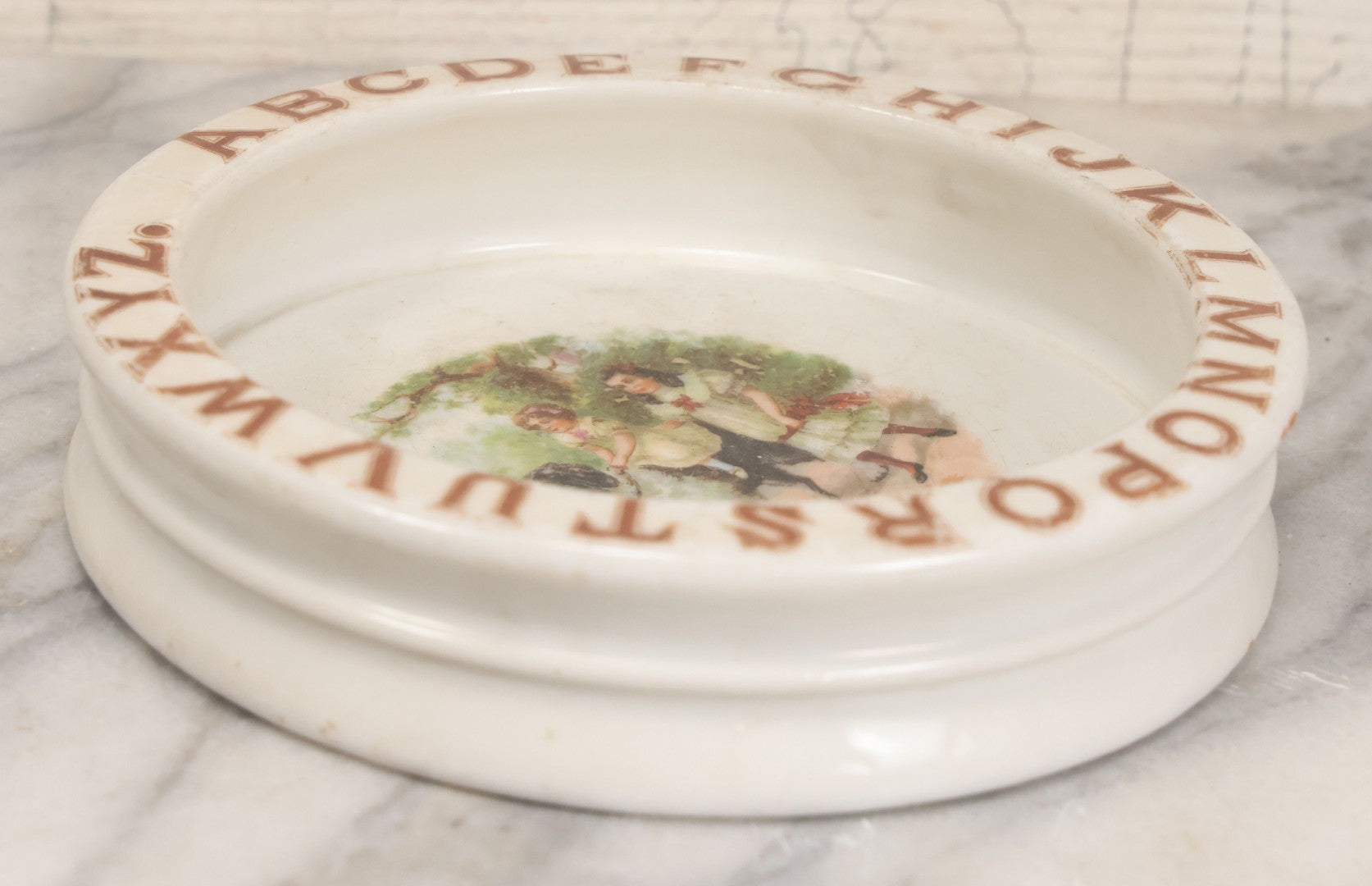 Lot 039 - Pair Of Antique Children's Plate Bowls Including Alphabet Dish With Children Riding Dog And Baby Dish With Child Playing With Toys, Marked Made In Czecho-Slovakia