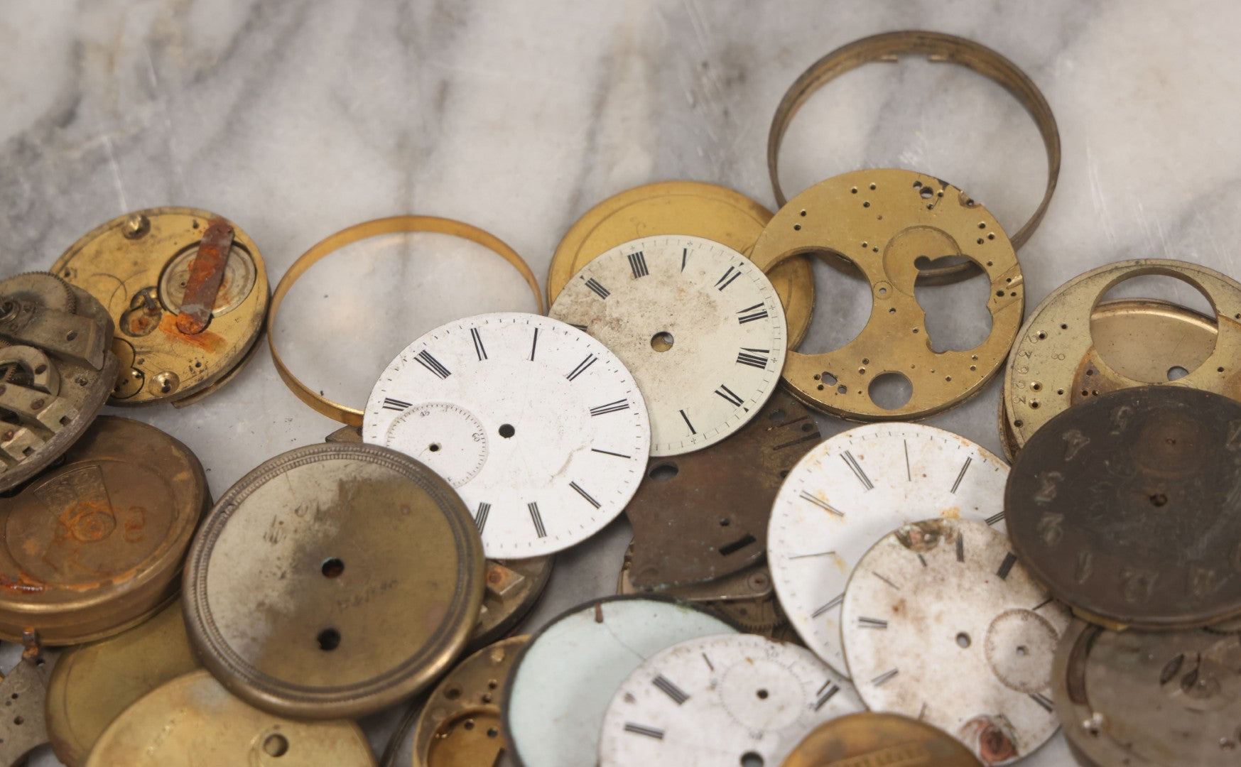 Lot 048 - Mixed Antique Salvage Grouping Of Pocket Watch Parts Including Porcelein Clock Faces, Movements, And Case Parts, 35+ Pieces, Makers Include J.F. Cooper, William Favre, F. Huquenm, M.J. Tobias