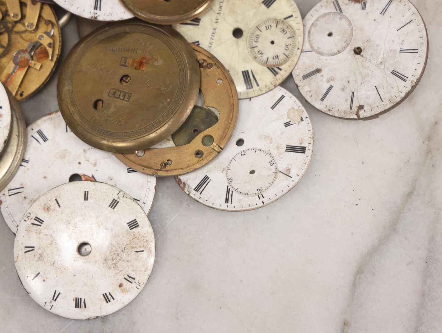 Lot 048 - Mixed Antique Salvage Grouping Of Pocket Watch Parts Including Porcelein Clock Faces, Movements, And Case Parts, 35+ Pieces, Makers Include J.F. Cooper, William Favre, F. Huquenm, M.J. Tobias