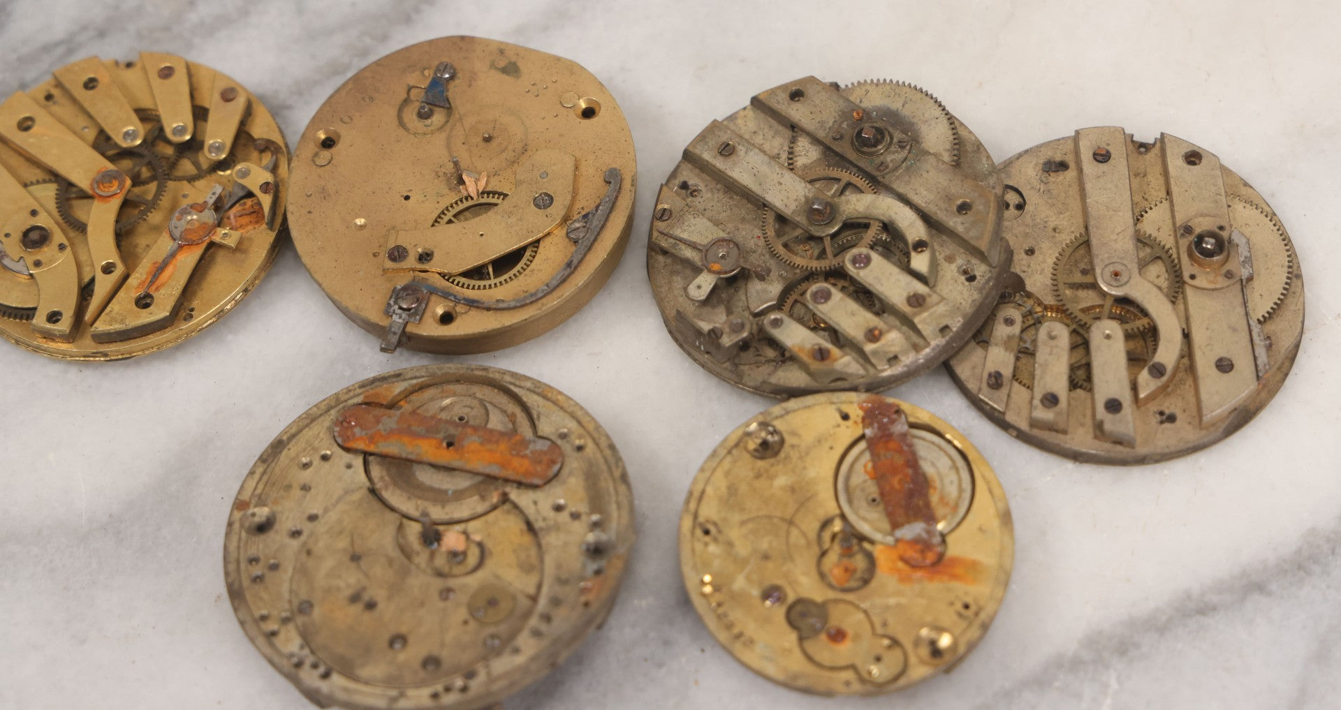 Lot 048 - Mixed Antique Salvage Grouping Of Pocket Watch Parts Including Porcelein Clock Faces, Movements, And Case Parts, 35+ Pieces, Makers Include J.F. Cooper, William Favre, F. Huquenm, M.J. Tobias