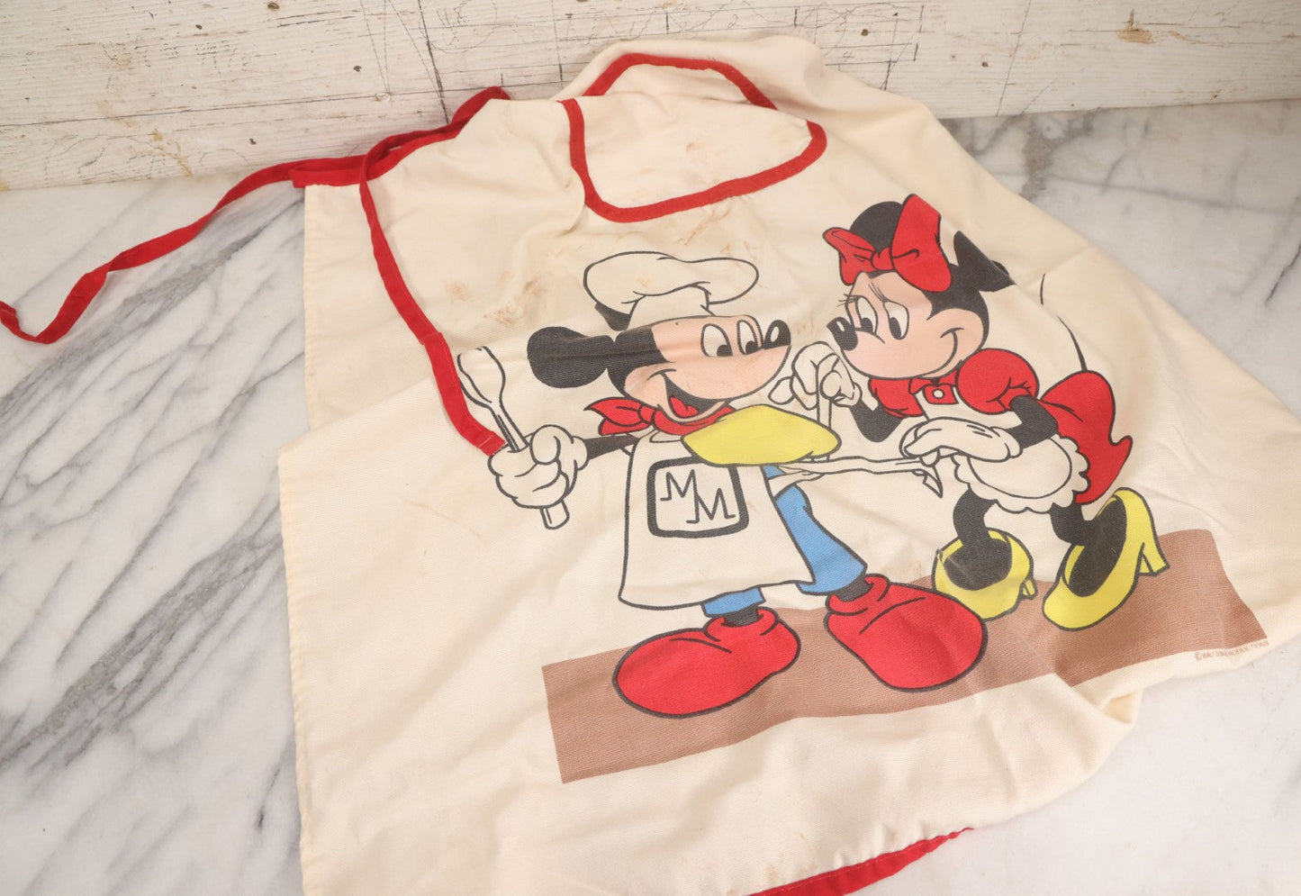 Lot 056 - Vintage Mickey And Minnie Mouse Printed Chef's Apron With Red Trim, Copyright Walt Disney Productions