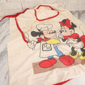 Lot 056 - Vintage Mickey And Minnie Mouse Printed Chef's Apron With Red Trim, Copyright Walt Disney Productions