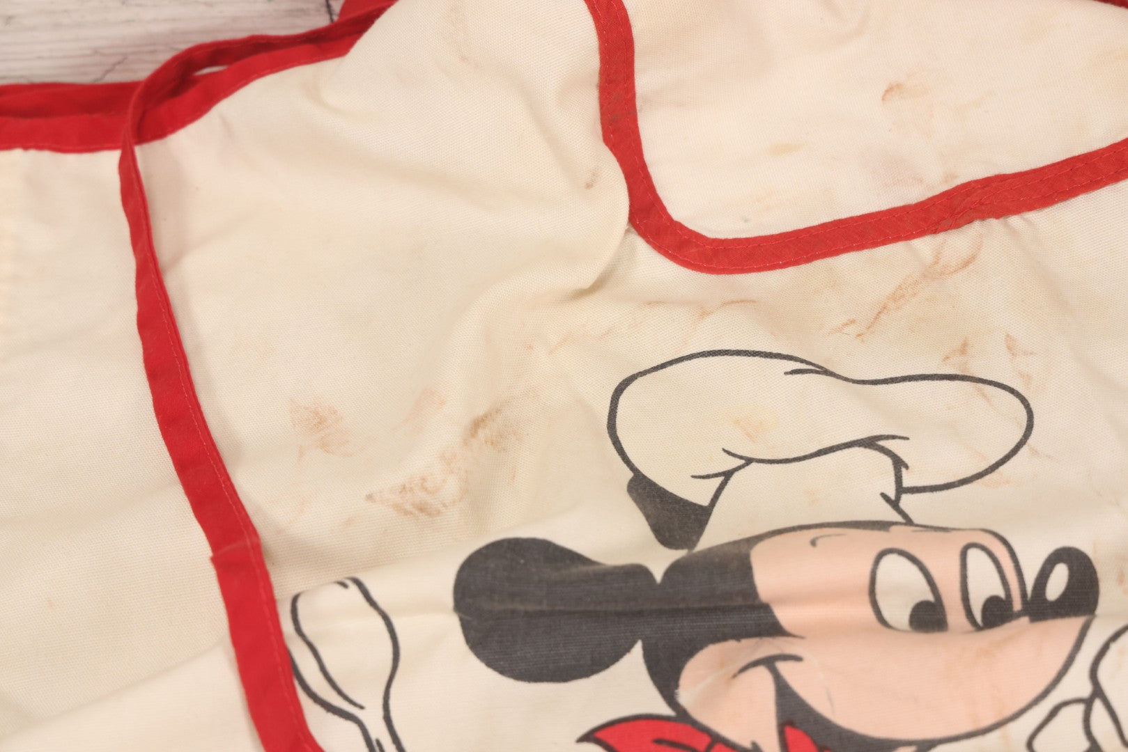 Lot 056 - Vintage Mickey And Minnie Mouse Printed Chef's Apron With Red Trim, Copyright Walt Disney Productions