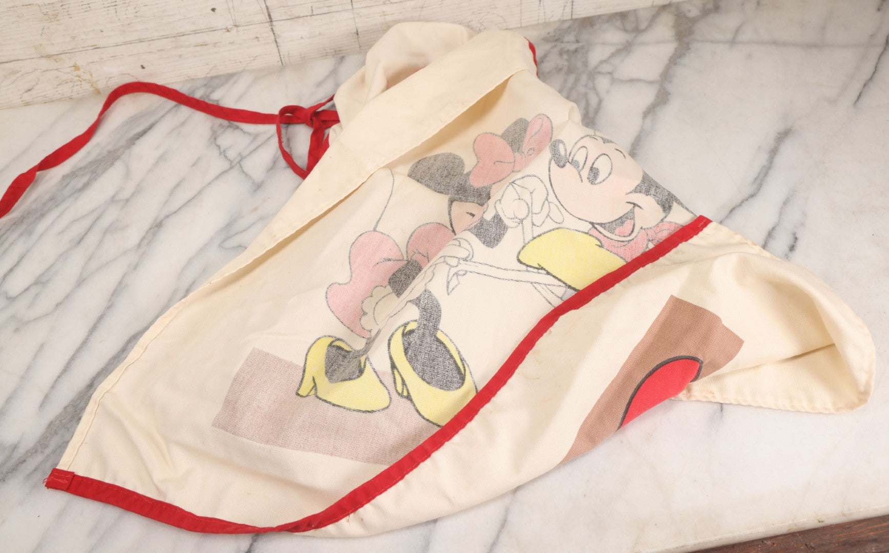 Lot 056 - Vintage Mickey And Minnie Mouse Printed Chef's Apron With Red Trim, Copyright Walt Disney Productions