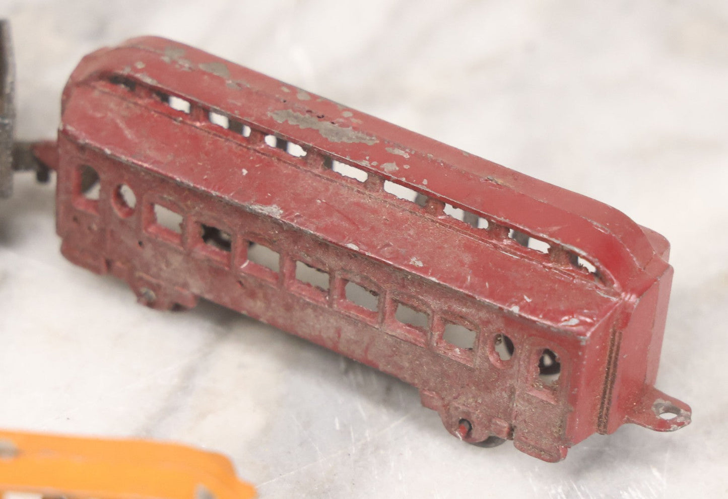 Lot 057 - Grouping Of Seven Vintage Prewar Diecast Train Toys With Original Paint, Including Two Locomotives, Two Tenders, Two Passenger Cars, And One Freight Car
