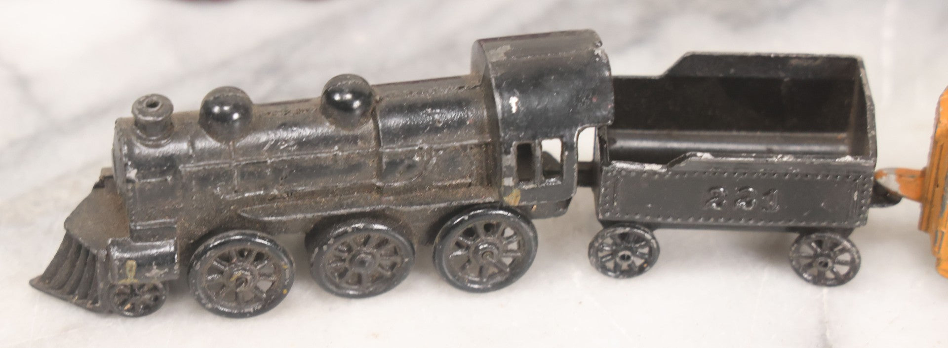 Lot 057 - Grouping Of Seven Vintage Prewar Diecast Train Toys With Original Paint, Including Two Locomotives, Two Tenders, Two Passenger Cars, And One Freight Car