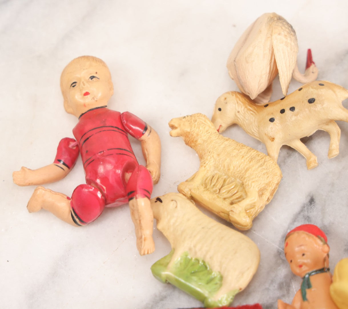 Lot 058 - Box Lot Grouping Of 19 Vintage Celluloid Dolls And Animal Toys Including Hippo, Elephant, Polar Bear, Camel, Donkey, Fish, And More