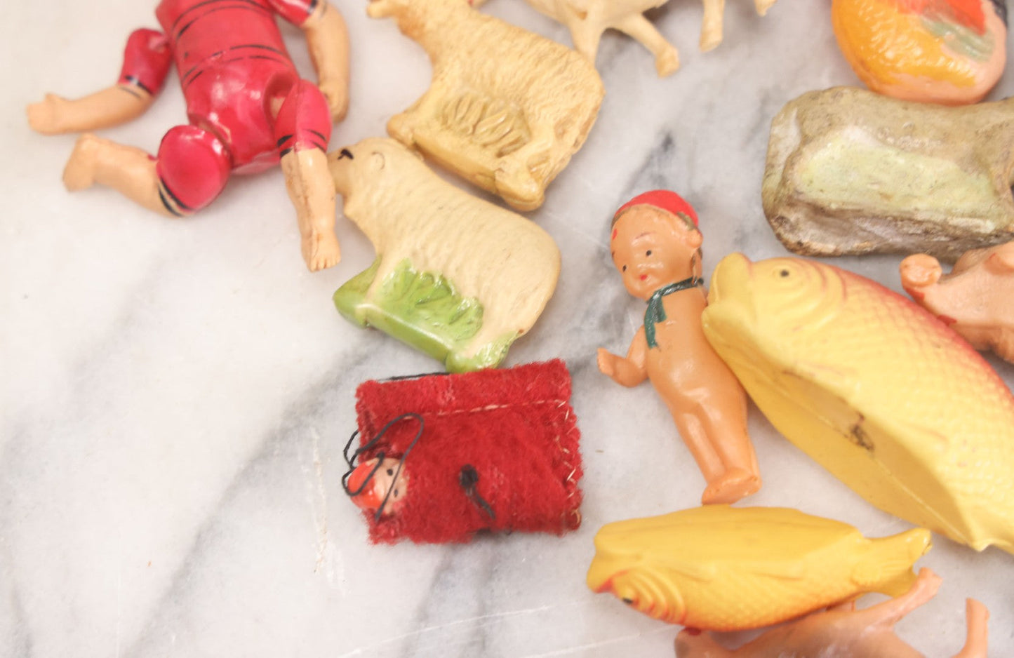 Lot 058 - Box Lot Grouping Of 19 Vintage Celluloid Dolls And Animal Toys Including Hippo, Elephant, Polar Bear, Camel, Donkey, Fish, And More