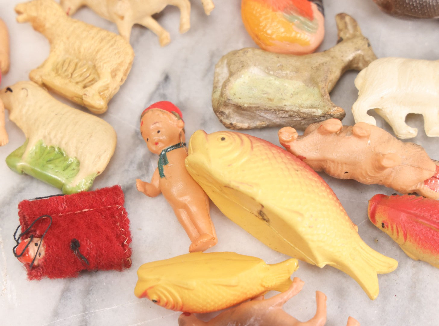 Lot 058 - Box Lot Grouping Of 19 Vintage Celluloid Dolls And Animal Toys Including Hippo, Elephant, Polar Bear, Camel, Donkey, Fish, And More